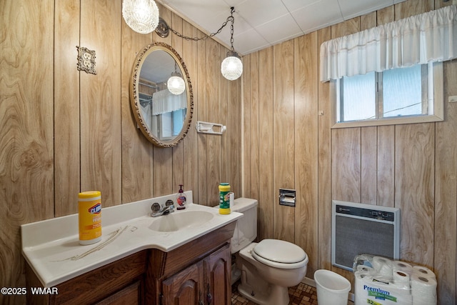 367 S Main St, Eagar, AZ 85925 - bathroom featuring wooden walls, heating unit, and vanity
