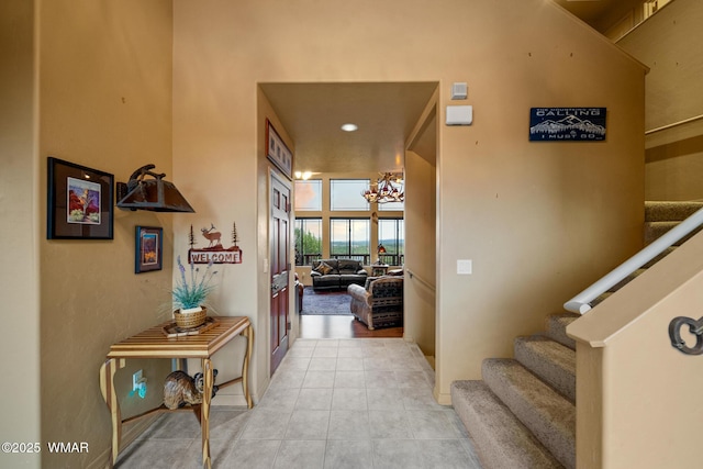 1511 S Canyon Ridge Trl, Show Low, AZ 85901 - hallway with a chandelier, light tile patterned floors, stairs, baseboards, and recessed lighting