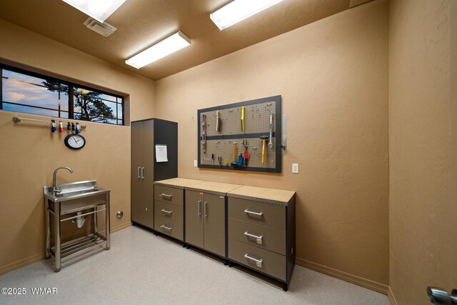 1511 S Canyon Ridge Trl, Show Low, AZ 85901 - miscellaneous room featuring a sink and baseboards