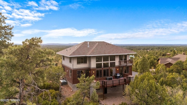 1511 S Canyon Ridge Trl, Show Low, AZ 85901 - rear view of property with a balcony, a forest view, a deck, and a shingled roof
