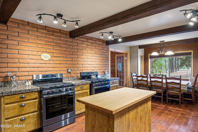 2444 S Jan Ln, Pinetop, AZ 85935 - kitchen featuring gas range, butcher block counters, dark wood-type flooring, beamed ceiling, and a chandelier