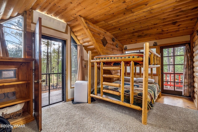 2444 S Jan Ln, Pinetop, AZ 85935 - unfurnished bedroom with vaulted ceiling, multiple windows, carpet flooring, and access to exterior