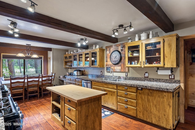 2444 S Jan Ln, Pinetop, AZ 85935 - kitchen featuring wooden counters, beamed ceiling, stainless steel dishwasher, light wood-style flooring, and glass insert cabinets