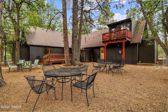 2444 S Jan Ln, Pinetop, AZ 85935 - back of property featuring outdoor dining area, a metal roof, and a deck