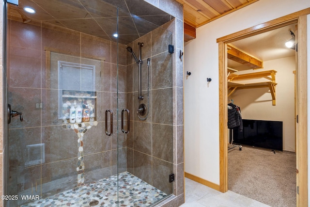 2444 S Jan Ln, Pinetop, AZ 85935 - bathroom featuring a shower stall, a walk in closet, recessed lighting, and tile patterned floors