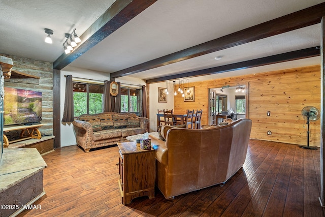 2444 S Jan Ln, Pinetop, AZ 85935 - living room with hardwood / wood-style flooring, wooden walls, beamed ceiling, and healthy amount of natural light