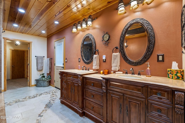 2444 S Jan Ln, Pinetop, AZ 85935 - bathroom with double vanity, inlaid floor details, tile patterned flooring, wood ceiling, and recessed lighting
