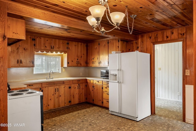 3510 Sunset Ln, Lakeside, AZ 85929 - kitchen featuring white appliances, tile patterned floors, wooden ceiling, light countertops, and a chandelier