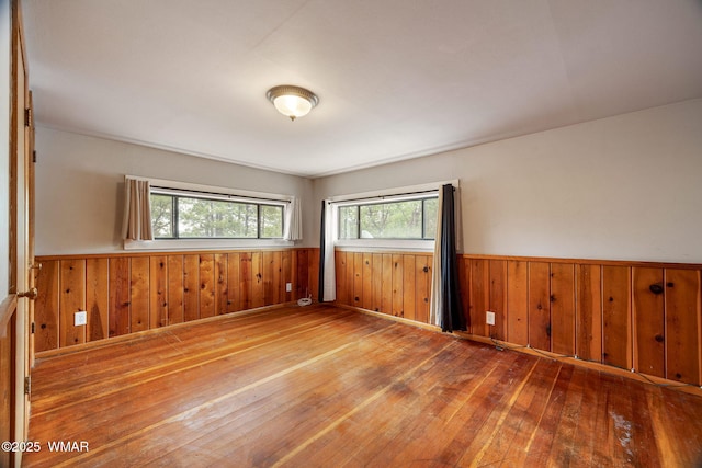 3510 Sunset Ln, Lakeside, AZ 85929 - empty room featuring wainscoting, hardwood / wood-style flooring, and wood walls