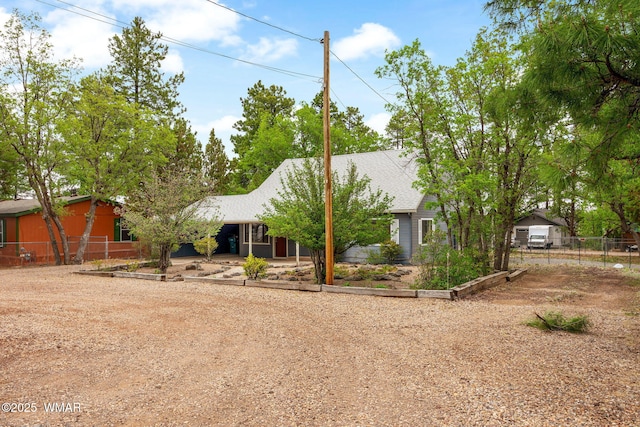3510 Sunset Ln, Lakeside, AZ 85929 - view of property hidden behind natural elements with dirt driveway and a vegetable garden