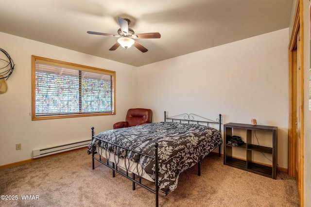 bedroom featuring a baseboard heating unit, light colored carpet, baseboards, and a ceiling fan