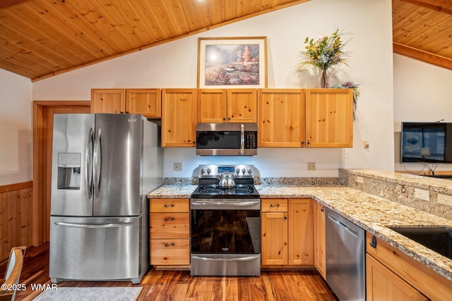 kitchen with lofted ceiling, wood ceiling, wood finished floors, light stone countertops, and stainless steel appliances