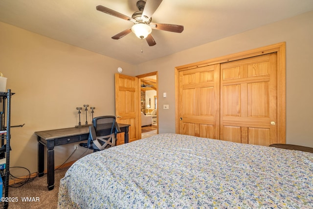 bedroom featuring ceiling fan and carpet