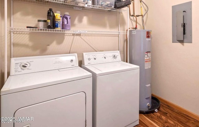 washroom with laundry area, separate washer and dryer, wood finished floors, water heater, and electric panel