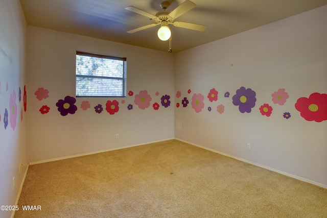 unfurnished room with ceiling fan, carpet, and baseboards