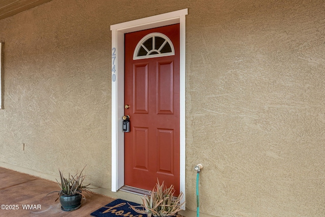 2740 E Walnut Dr, Taylor, AZ 85939 - view of exterior entry featuring stucco siding