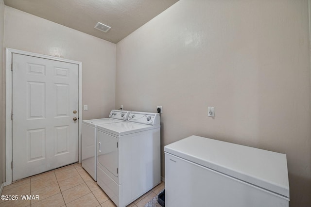 2740 E Walnut Dr, Taylor, AZ 85939 - laundry area featuring independent washer and dryer and light tile patterned flooring