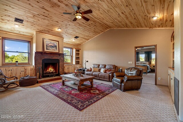 living room with light carpet, wooden ceiling, a lit fireplace, and lofted ceiling
