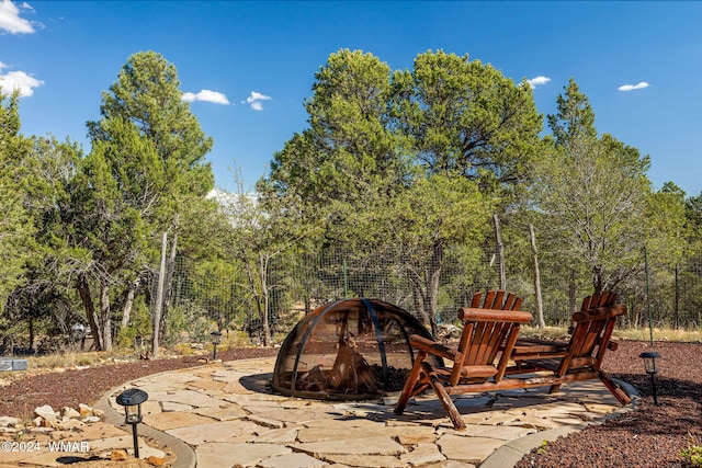 view of patio with an outdoor fire pit