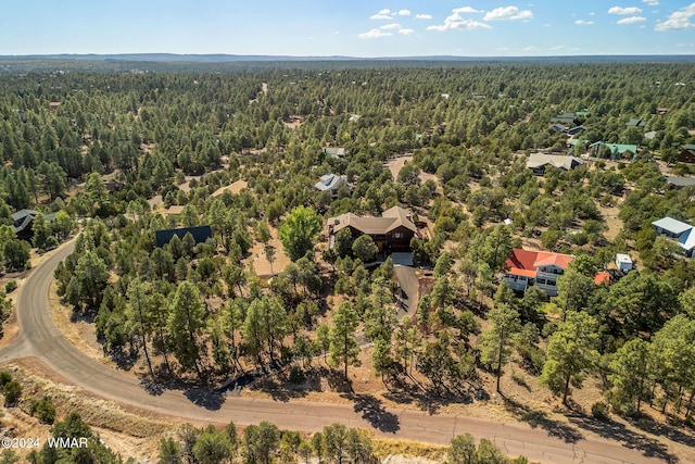 bird's eye view featuring a forest view