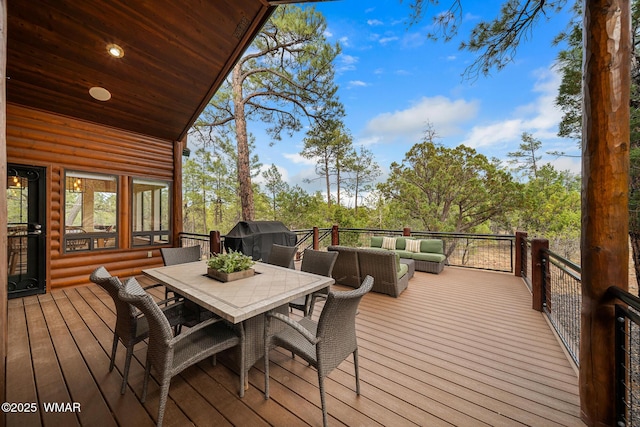 wooden terrace featuring outdoor dining space and an outdoor living space