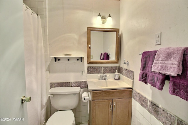 2413 Lupine Cir, Pinetop, AZ 85935 - bathroom with vanity, tile walls, toilet, and a wainscoted wall