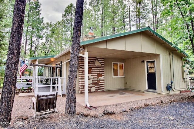 2413 Lupine Cir, Pinetop, AZ 85935 - view of front of property featuring a chimney, a patio area, and an attached carport