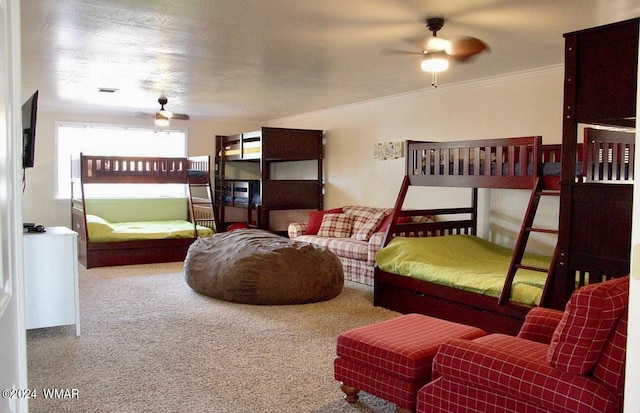 carpeted bedroom featuring visible vents and ornamental molding