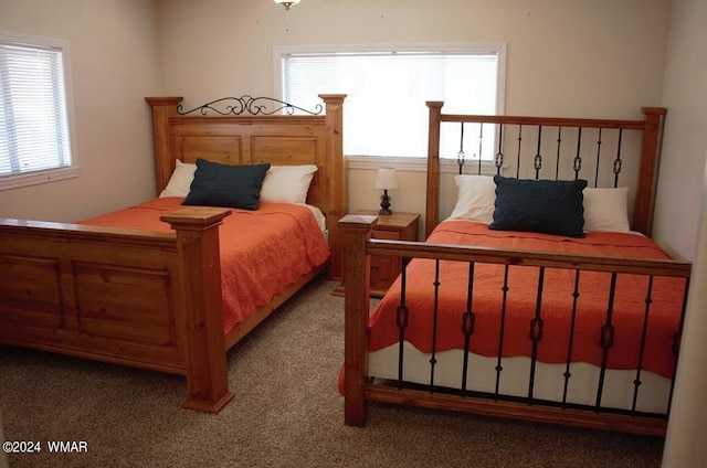 bedroom featuring light carpet