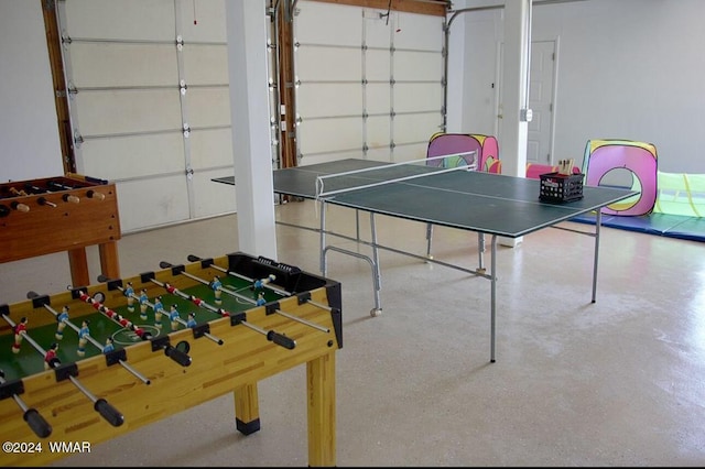 playroom with light speckled floor and a garage