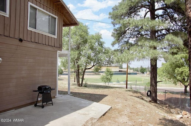 view of yard with a patio and fence