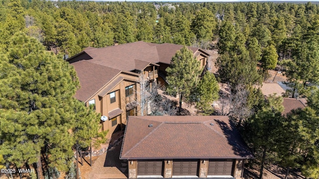 drone / aerial view with a view of trees