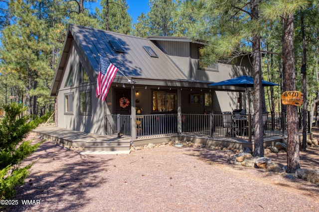 6970 Palomino Dr, Pinetop, AZ 85935 - rustic home with a porch and metal roof