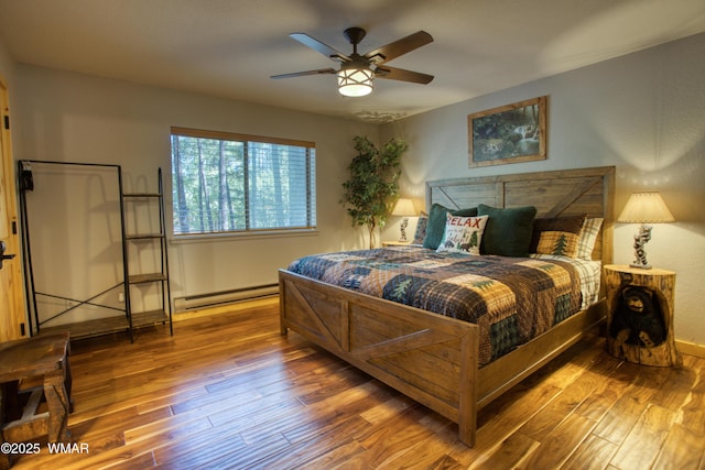 6970 Palomino Dr, Pinetop, AZ 85935 - bedroom with baseboards, a baseboard radiator, and hardwood / wood-style flooring