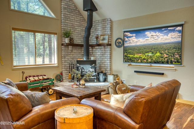 6970 Palomino Dr, Pinetop, AZ 85935 - living area with lofted ceiling, wood finished floors, and a wood stove