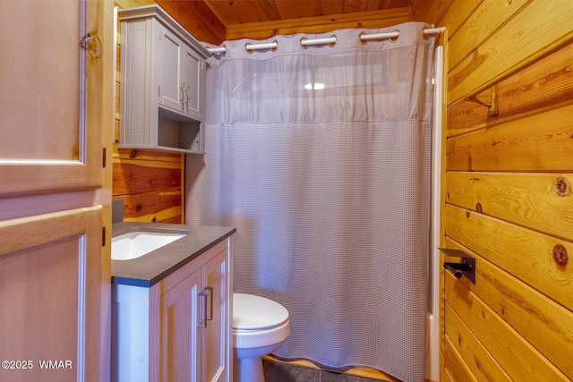 4269 Rock Rd, Snowflake, AZ 85937 - bathroom with vanity, a shower with shower curtain, and wooden walls