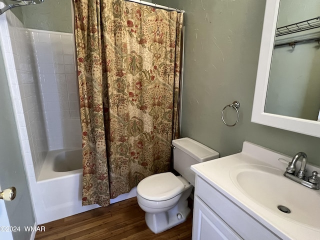 bathroom with toilet, shower / bathtub combination with curtain, vanity, and wood finished floors