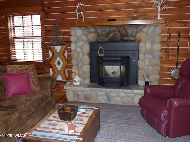living area featuring a stone fireplace