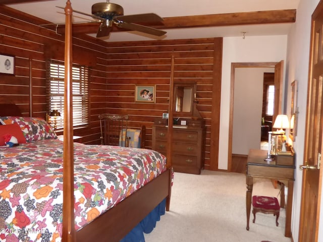carpeted bedroom featuring multiple windows