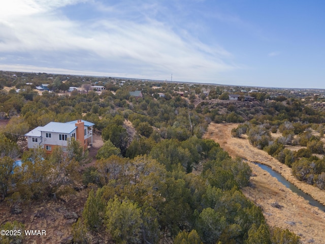 drone / aerial view with a view of trees