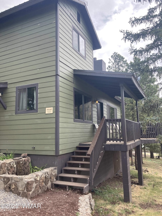 view of property exterior featuring stairway