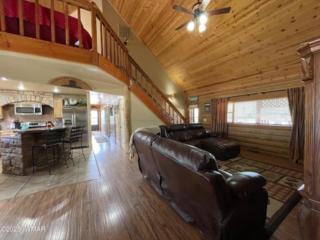 183 N Becker Lake Rd, Springerville, AZ 85938 - living area with stairs, ceiling fan, high vaulted ceiling, light wood-type flooring, and wood ceiling