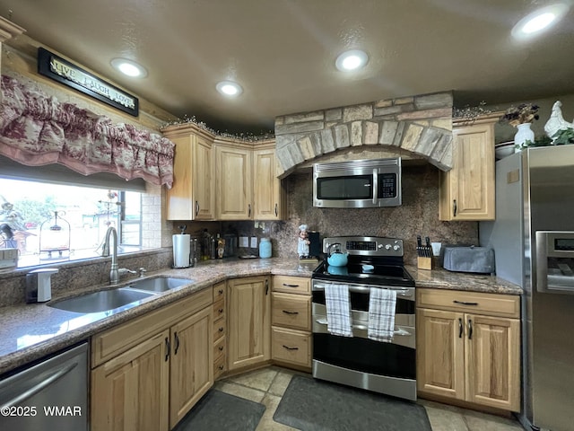 183 N Becker Lake Rd, Springerville, AZ 85938 - kitchen featuring appliances with stainless steel finishes, tasteful backsplash, light stone counters, light brown cabinets, and recessed lighting
