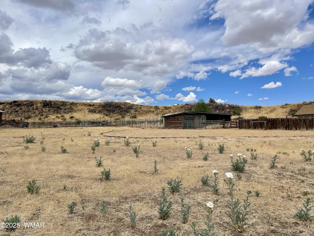 183 N Becker Lake Rd, Springerville, AZ 85938 - view of yard featuring an outdoor structure, a rural view, and an exterior structure