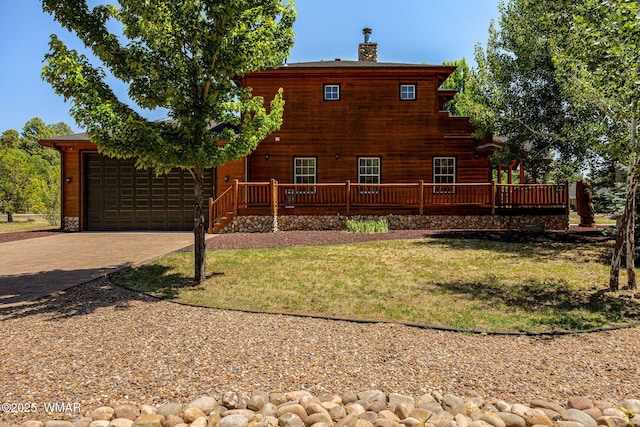 1415 N Lake View Cir, Lakeside, AZ 85929 - view of side of home with decorative driveway, a lawn, an attached garage, a wooden deck, and a chimney