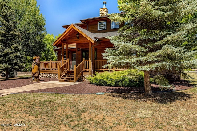 1415 N Lake View Cir, Lakeside, AZ 85929 - view of front of house featuring a chimney, a front yard, and a wooden deck