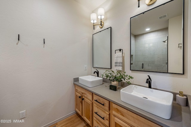 1415 N Lake View Cir, Lakeside, AZ 85929 - full bath featuring double vanity, a shower stall, and wood finished floors
