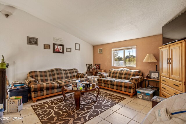 69 E Central Ave, Eagar, AZ 85925 - living room featuring lofted ceiling and light tile patterned flooring