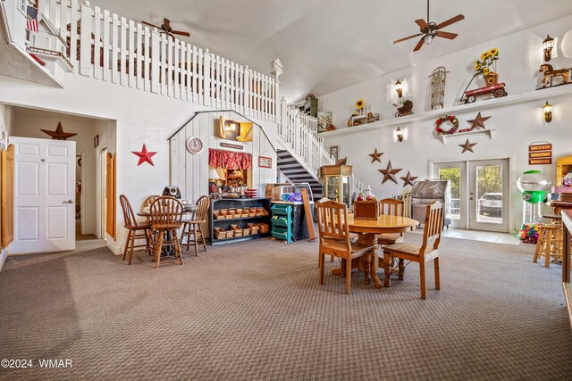 69 E Central Ave, Eagar, AZ 85925 - carpeted dining area with french doors, ceiling fan, stairway, and a high ceiling