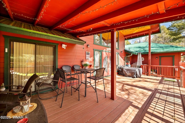 deck featuring outdoor dining space